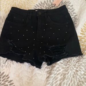 Black shorts with rhinestones on front